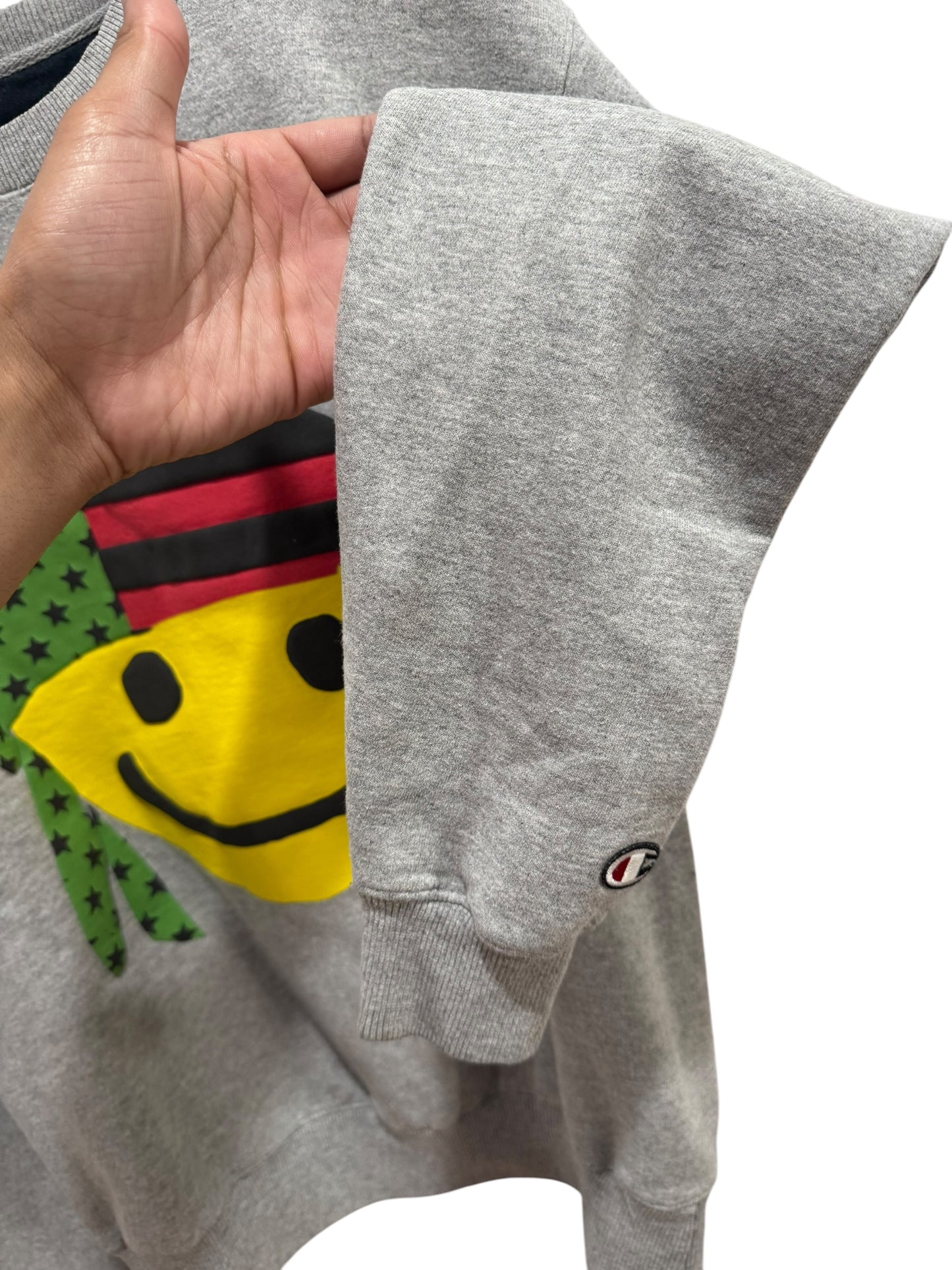 Denim Tears x Cactus Plant Flea Market Pan African Smiley Crewneck Grey