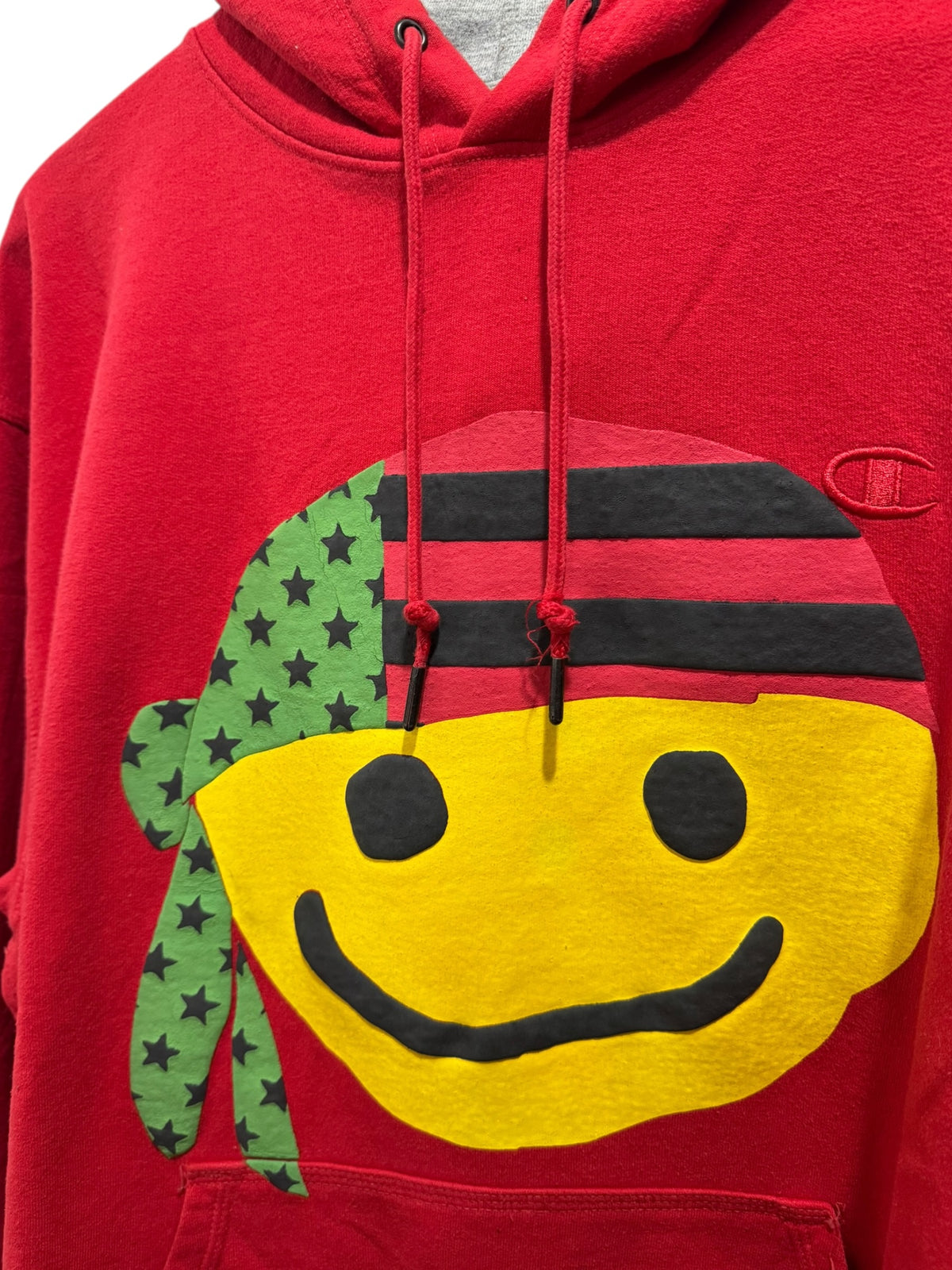 Denim Tears x Cactus Plant Flea Market Pan African Smiley Hoodie Red