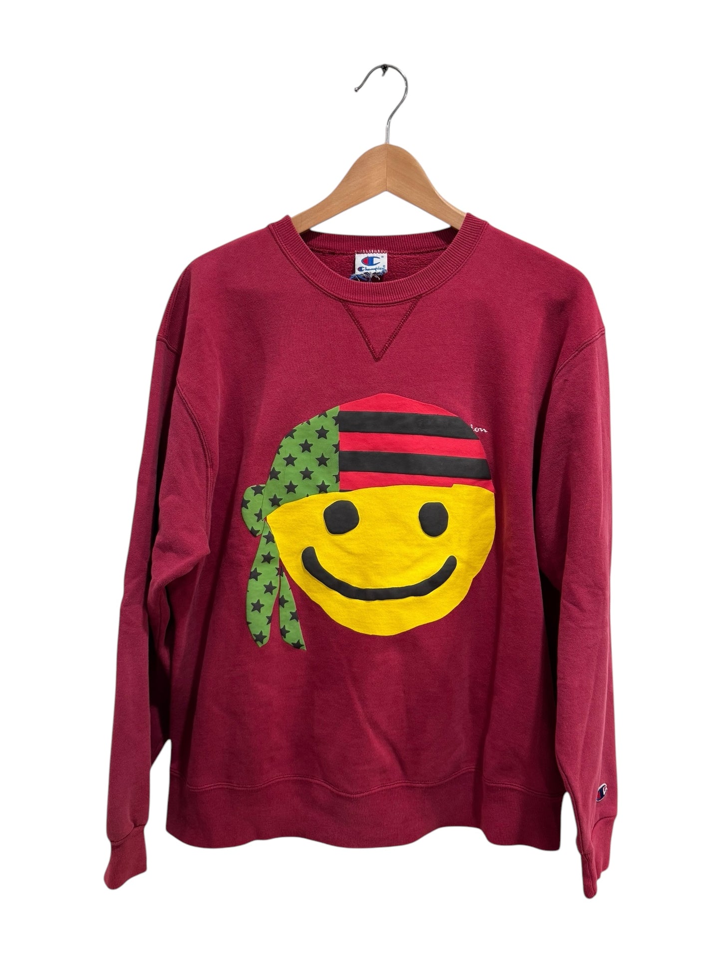 Denim Tears x Cactus Plant Flea Market Pan African Smiley Crewneck Dark Red